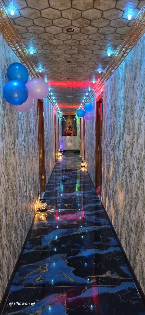 Blue and multicolour lit corridor at Phoenix International Spa
