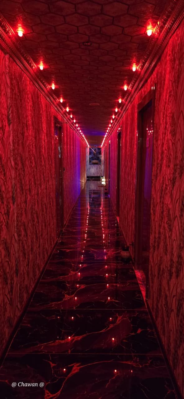 Dramatic red-lit corridor at Phoenix International Spa
